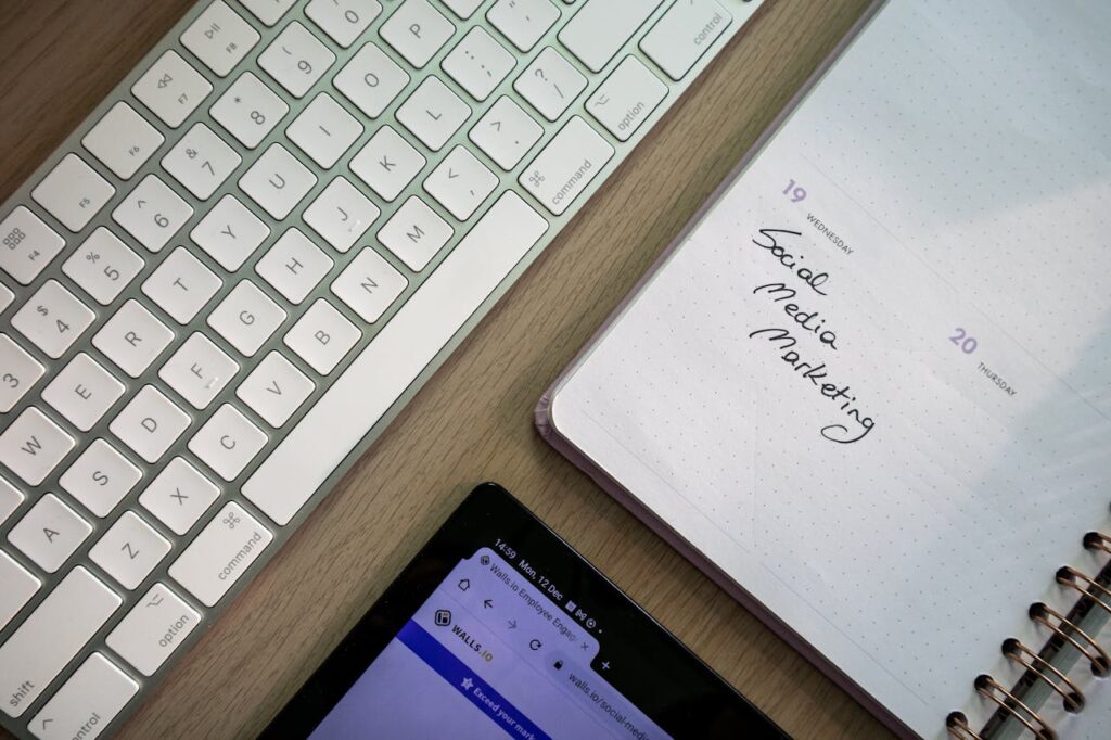 Close-up of a Notebook, Tablet and Keyboard on a Desk